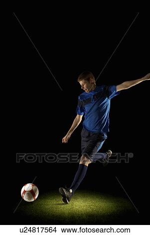 Picture - Footballer about to kick a ball. Fotosearch