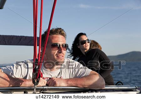 Stock Photo - Friends on yacht. Fotosearch