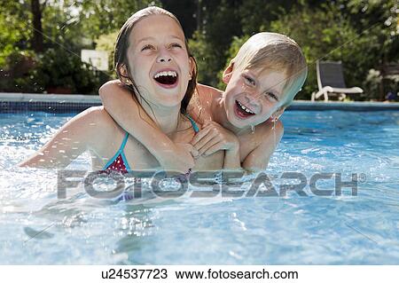 Girl and Boy in Swimming pool View Large Photo Image Stock Image - Girl and Boy in Swimming pool. Fotosearch