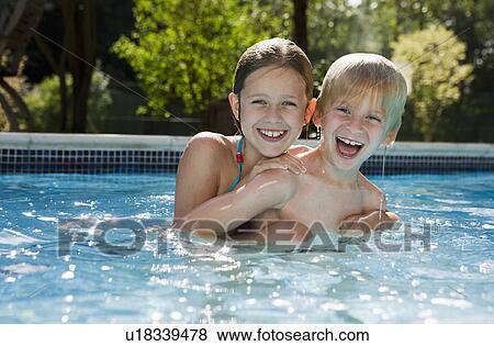 Stock Photo - Girl and Boy in Swimming pool. Fotosearch
