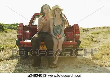 Girl and young man eating watermelon View Large Photo Image Stock Image - Girl and young man eating watermelon. Fotosearch