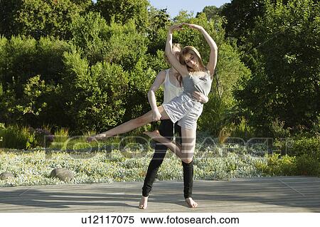 Girl assisting girl doing ballet View Large Photo Image Stock Photography - Girl assisting girl doing ballet. Fotosearch