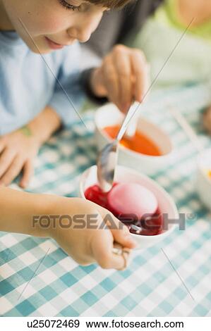 girl coloring Easter eggs View Large Photo Image Stock Photo - girl coloring Easter eggs. Fotosearch
