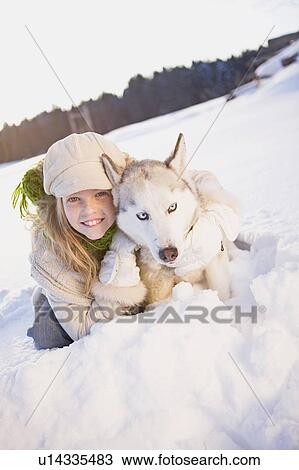 Girl embracing siberian husky View Large Photo Image Stock Image - Girl embracing siberian husky. Fotosearch