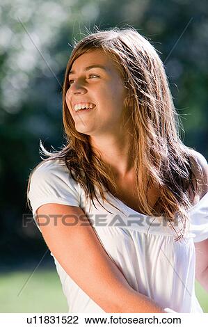 Girl in a garden View Large Photo Image Stock Image - Girl in a garden. Fotosearch