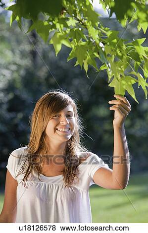 Girl in a garden View Large Photo Image Stock Photo - Girl in a garden. Fotosearch