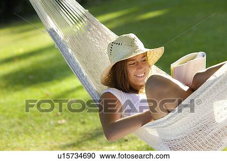 Girl in a hammock View Large Photo Image Stock Image - Girl in a hammock. Fotosearch