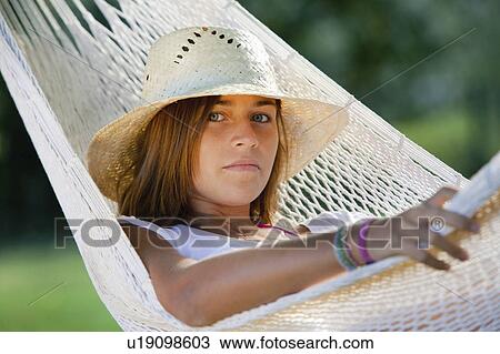 Girl in a hammock View Large Photo Image Stock Image - Girl in a hammock. Fotosearch