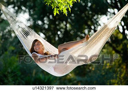 Girl in a hammock View Large Photo Image Stock Photo - Girl in a hammock. Fotosearch