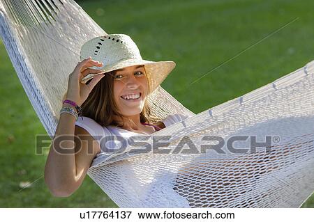 Girl in a hammock View Large Photo Image Stock Photo - Girl in a hammock. Fotosearch