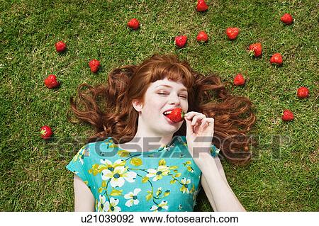 girl in grass surrounded by strawberries View Large Photo Image Stock Image - girl in grass surrounded by strawberries. Fotosearch