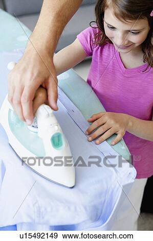 Stock Photo - Girl ironing. Fotosearch
