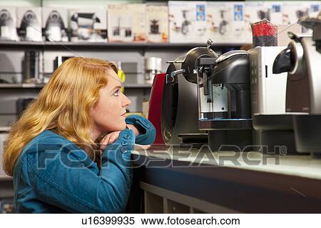 Girl is spoilt for choice View Large Photo Image Stock Photography - Girl is spoilt for choice. Fotosearch