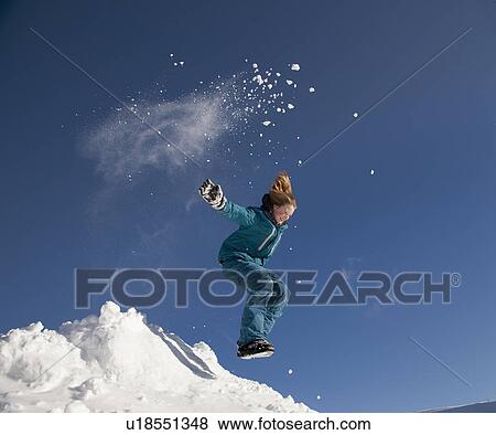 Girl jumping in snow View Large Photo Image Stock Photo - Girl jumping in snow. Fotosearch