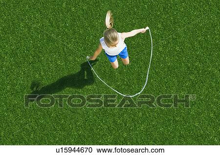 Stock Image - Girl jumping rope. Fotosearch