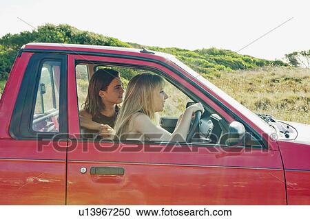 Stock Image - Girl learning to drive. Fotosearch