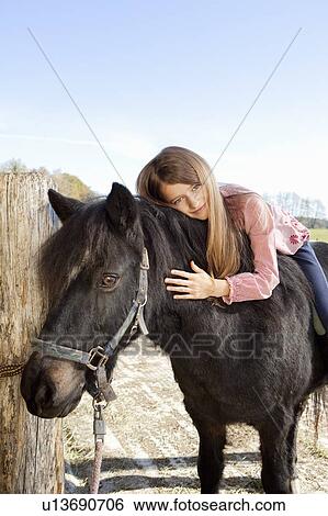 Girl on horseback View Large Photo Image Stock Photograph - Girl on horseback. Fotosearch