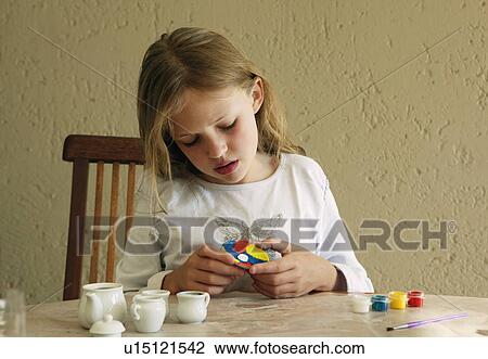 Girl painting china tea set View Large Photo Image Stock Image - Girl painting china tea set. Fotosearch