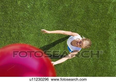 Girl playing ball View Large Photo Image Stock Photograph - Girl playing ball. Fotosearch