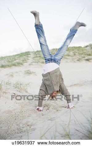 Girl playing on beach View Large Photo Image Stock Photo - Girl playing on beach. Fotosearch