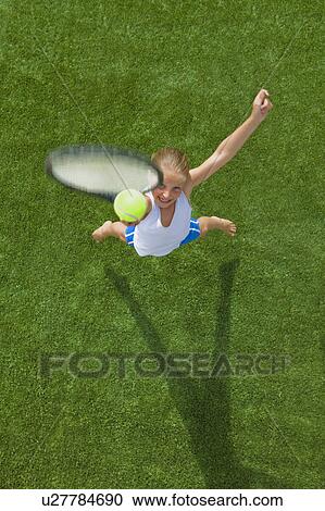 Stock Image - Girl playing tennis. Fotosearch