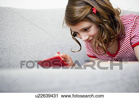 Girl playing video game View Large Photo Image Stock Image - Girl playing video game. Fotosearch