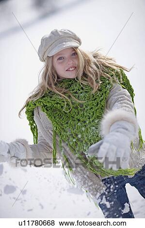 Girl throwing snow balls View Large Photo Image Stock Photo - Girl throwing snow balls. Fotosearch