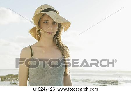 Girl wearing old sun hat View Large Photo Image Stock Photograph - Girl wearing old sun hat. Fotosearch