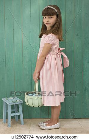 Picture - girl with a basket. Fotosearch