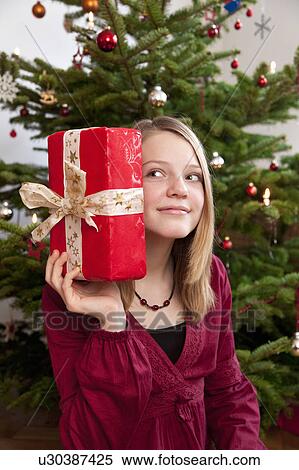 Stock Photography - girl with christmas present. Fotosearch