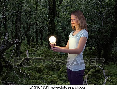 girl with energy saving light bulb View Large Photo Image Stock Image - girl with energy saving light bulb . Fotosearch