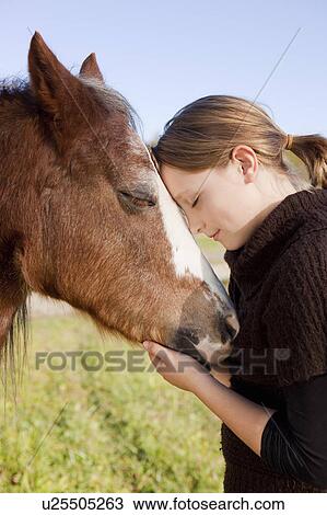 Stock Image - Girl with horse. Fotosearch
