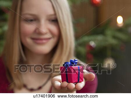 girl with small christmas present View Large Photo Image Stock Photograph - girl with small christmas present. Fotosearch