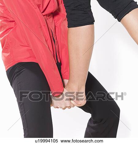 Stock Photography - Giving someone a leg up. Fotosearch