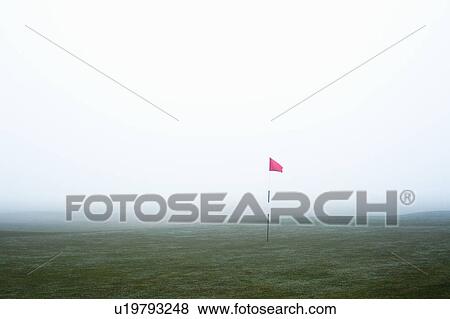Stock Photo - Golf flag in fog. Fotosearch