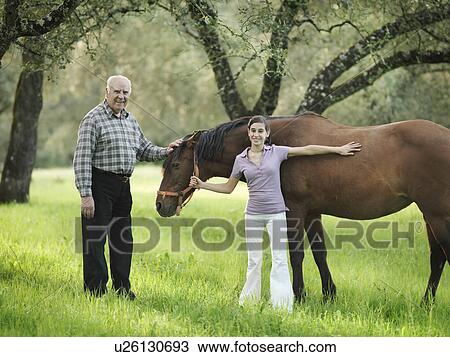 Grandad and granddaughter with horse View Large Photo Image Stock Image - Grandad and granddaughter with horse. Fotosearch