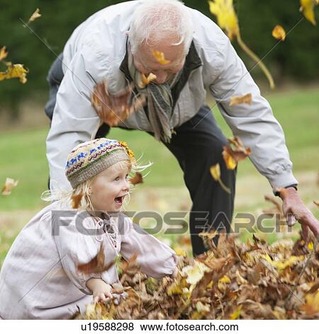 Grandfather and Granddaughter outdoors View Large Photo Image Stock Photo - Grandfather and Granddaughter outdoors. Fotosearch