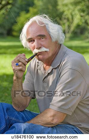 Grandfather smoking his pipe View Large Photo Image Stock Image - Grandfather smoking his pipe. Fotosearch