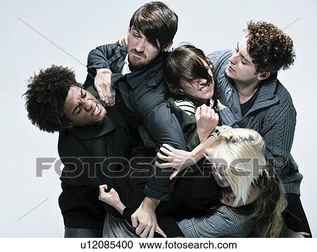 Stock Image - Group of adults fighting for space. Fotosearch
