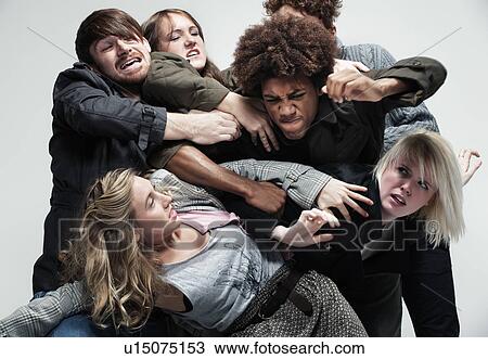 Stock Image - Group of adults fighting for space. Fotosearch