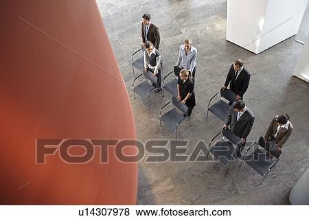 Group of business people with chairs View Large Photo Image Stock Photo - Group of business people with chairs. Fotosearch