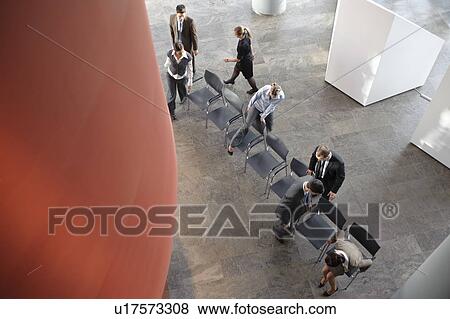 Group of business people with chairs View Large Photo Image Stock Photo - Group of business people with chairs. Fotosearch