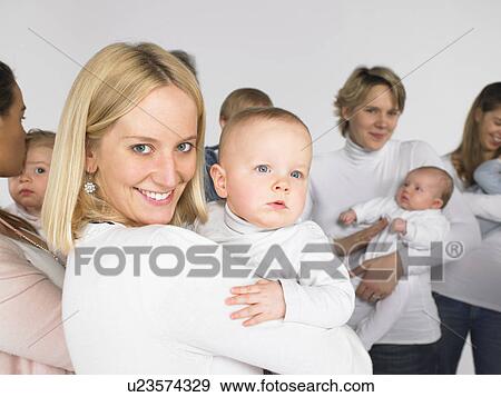 Stock Photo - Group of mothers and babies. Fotosearch