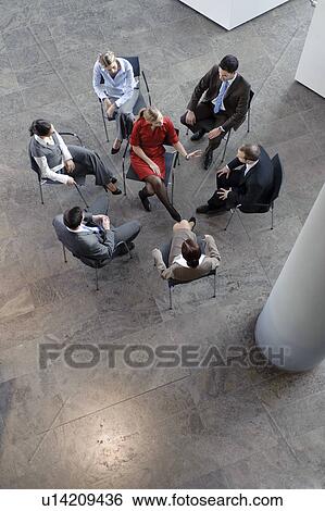 Stock Photograph - Group of people sitting in circle. Fotosearch