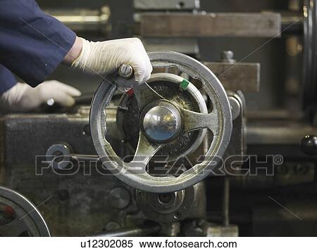 Hand Operating Wheel On Machine View Large Photo Image Stock Photography - Hand Operating Wheel On Machine. Fotosearch