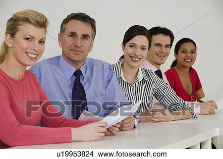Happy business colleagues look at camera View Large Photo Image Picture - Happy business colleagues look at camera. Fotosearch