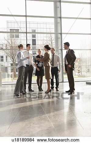 Picture - Happy business executives with champagne. Fotosearch