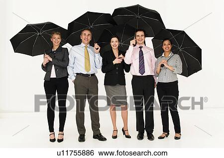 Stock Photograph - Happy business people with umbrellas. Fotosearch