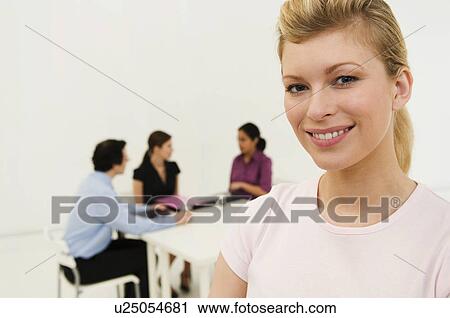 Happy business women looks to camera View Large Photo Image Stock Image - Happy business women looks to camera. Fotosearch