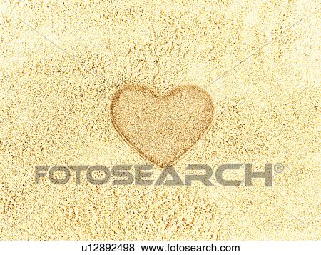 Stock Photo - Heart shape in sand. Fotosearch